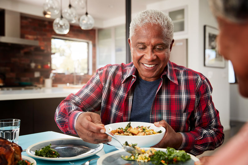 implant supported dentures patient eating.